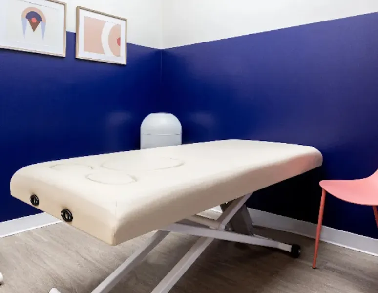 An inviting and uncluttered treatment room at Origin Carlsbad.