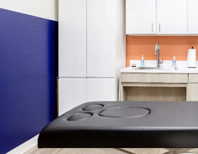 A colorful and calming physical therapy treatment room.