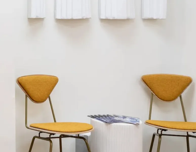 A shot of two designer chairs at Origin's spa-like Atlanta clinic.