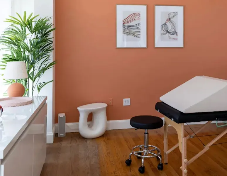 A relaxing, sunlit treatment room at the Origin clinic.