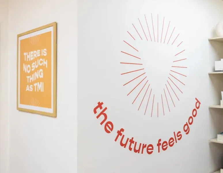Wall art featuring the phrase "the future feels good" at Origin's Sugar Land clinic.
