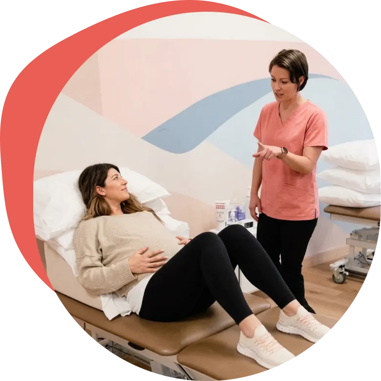 An Origin physical therapist providing in-person care at one of our spa-like clinics.