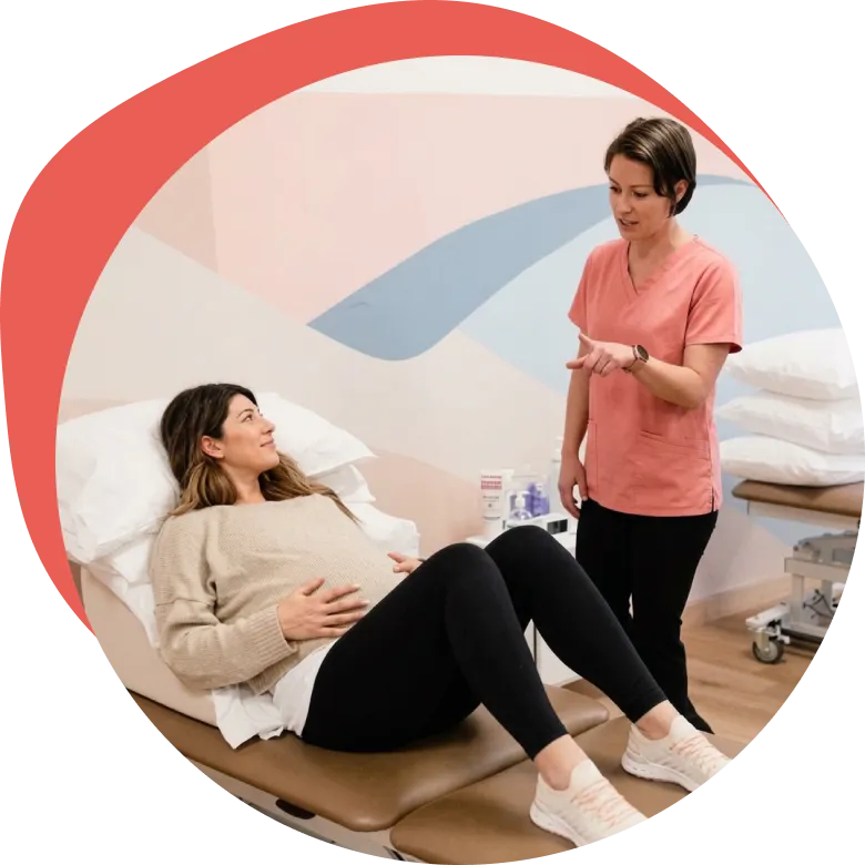 An Origin physical therapist providing in-person care at one of our spa-like clinics.