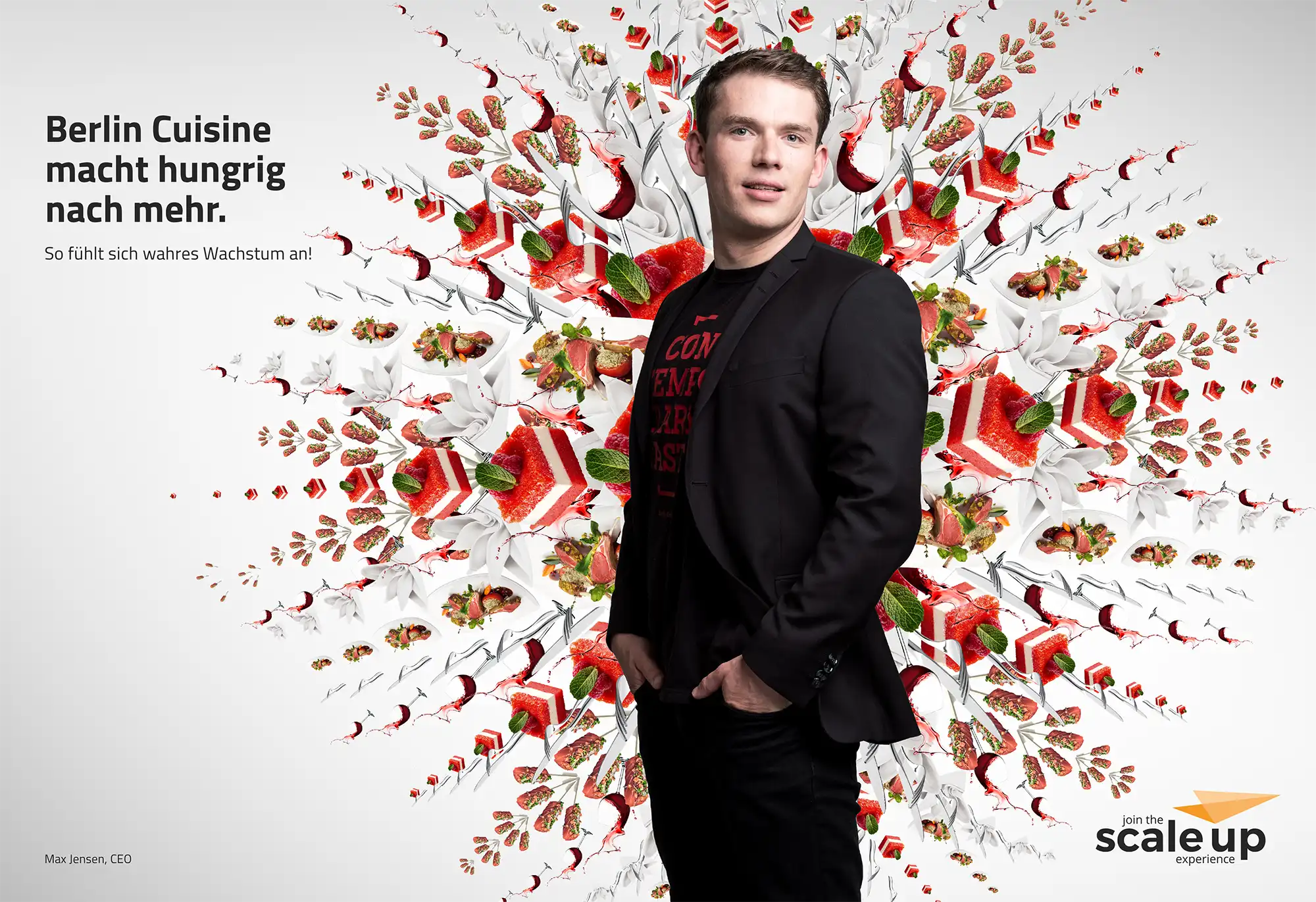 Max Jensen, der CEO von Berlin Cuisine portraitiert vor einer Explosion aus frei schwebenden Törtchen, Leckereien auf Tellern, Fingerfood, Servietten und Besteck.
