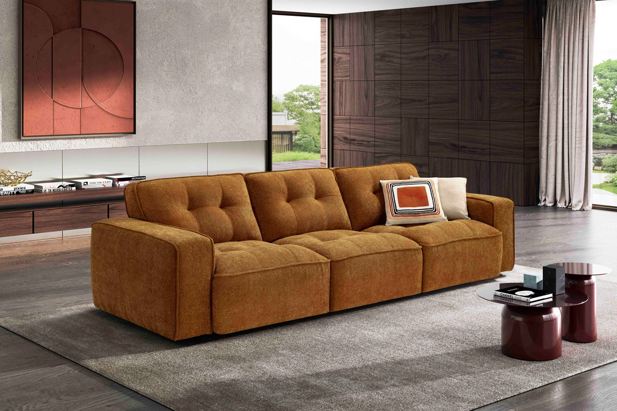 A living room with a couch and a table.