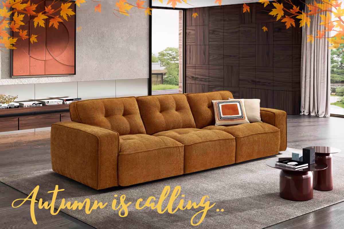 A living room with a couch and a table.