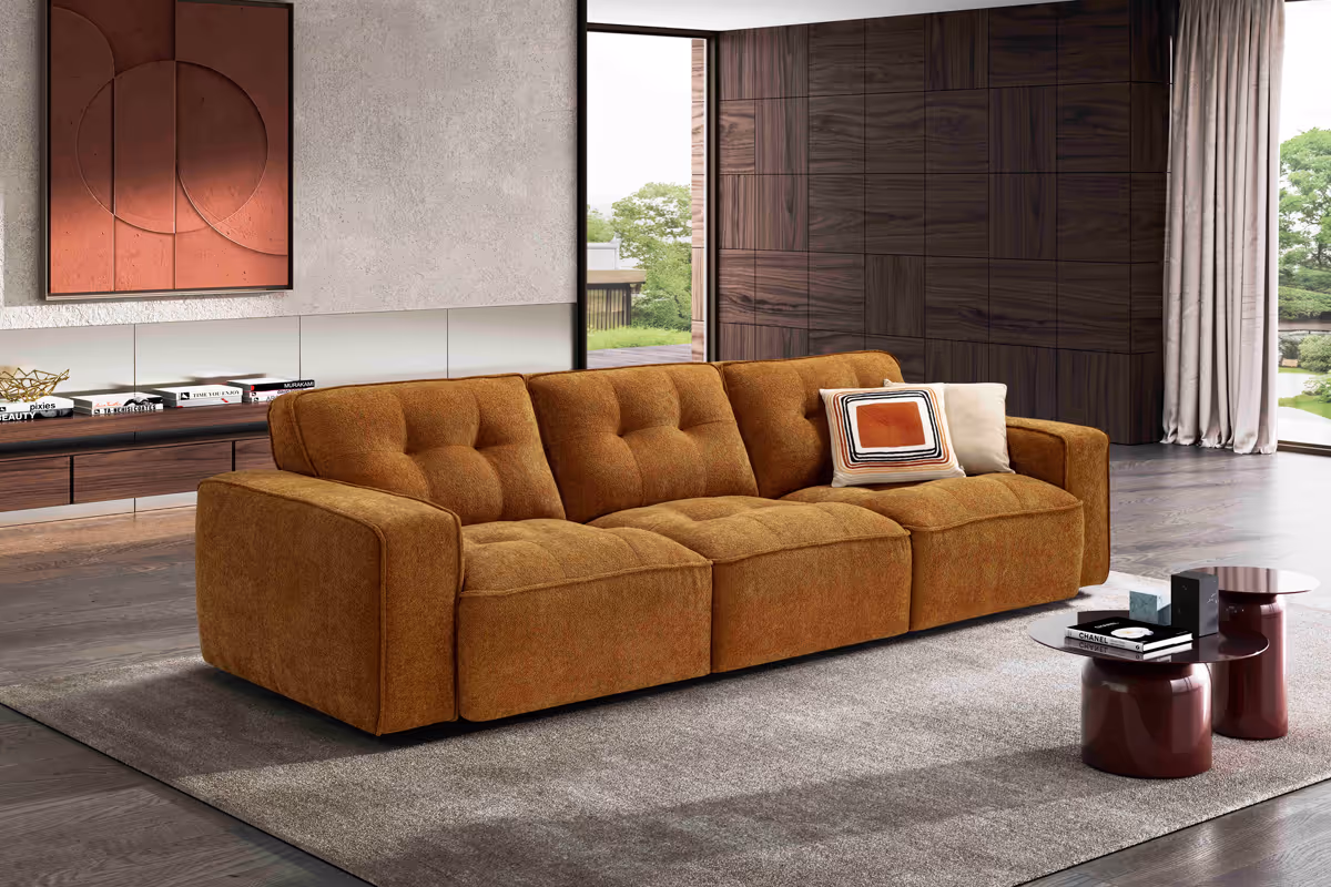 A living room with a couch and a table.