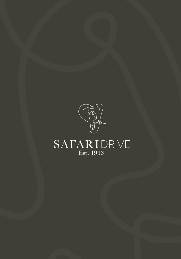 Safari Drive Vehicle driving on African dirt road at sunset