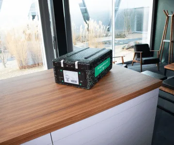 THE BOX on a wooden table