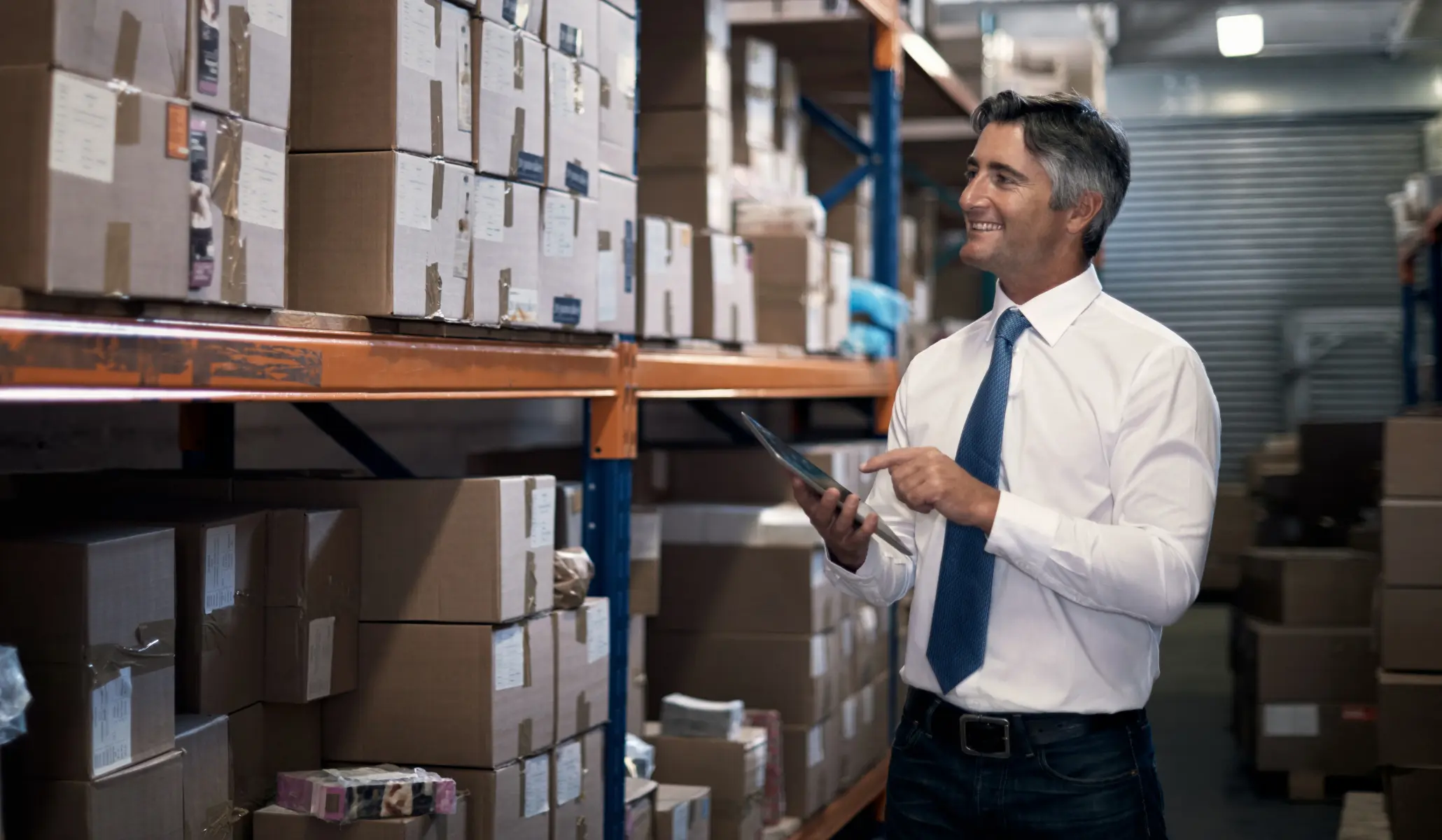 Man in a white shirt in a warehouse