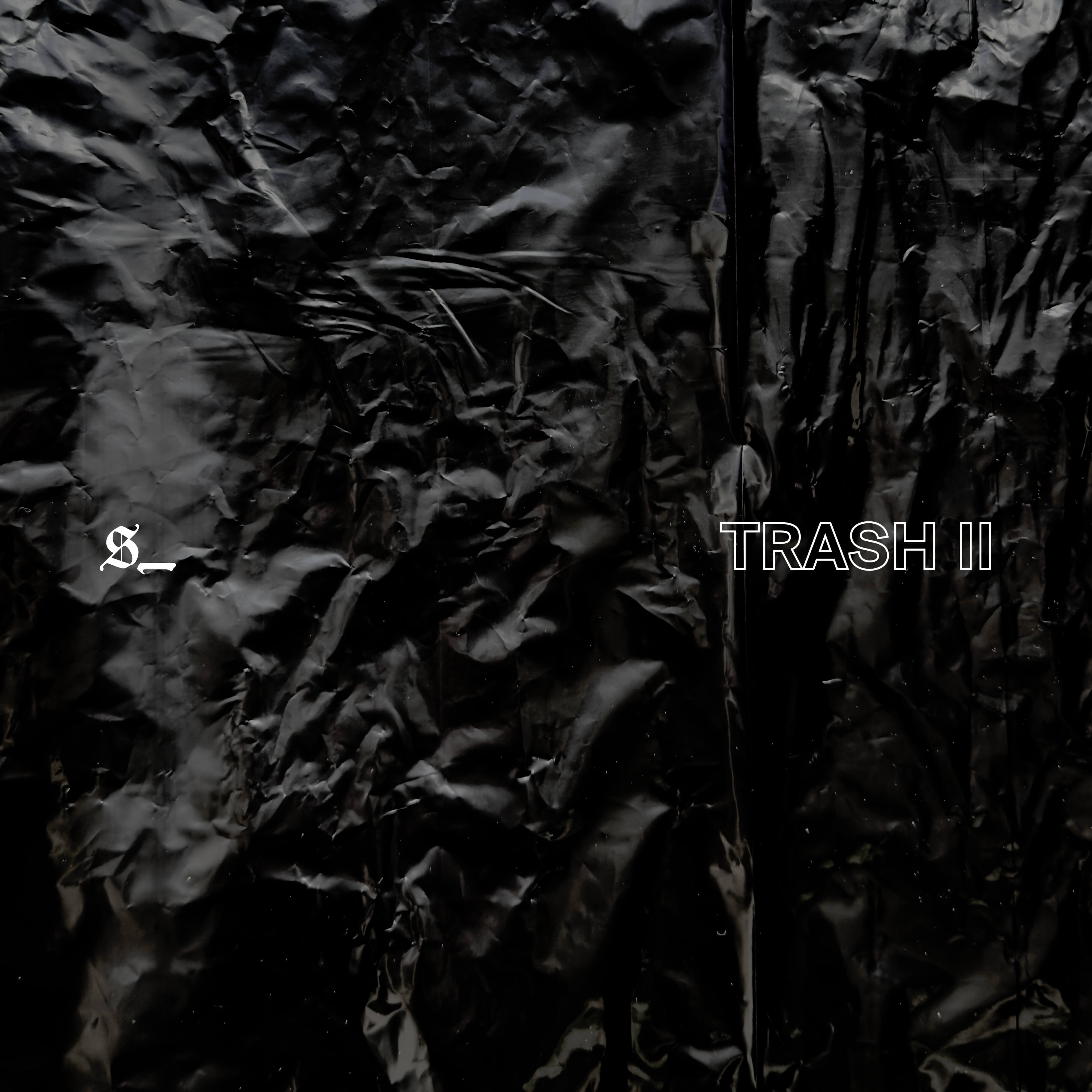 A black, wrinkled trash bag with the Sentient Spaces logo and the title Trash 2