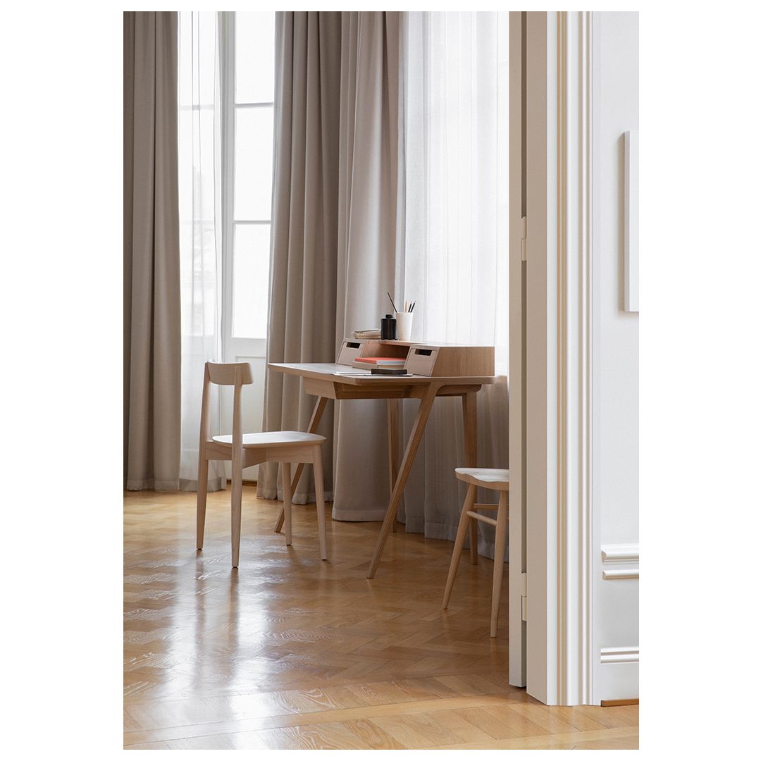 The Treviso Desk by Matthew Hilton imparts a rich, tactile q