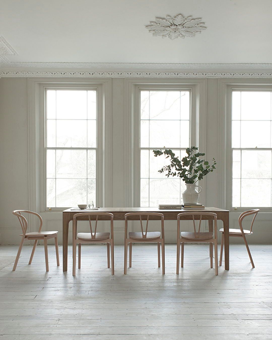 The Romana Extending Dining Table by Ercol pairs sculpted el