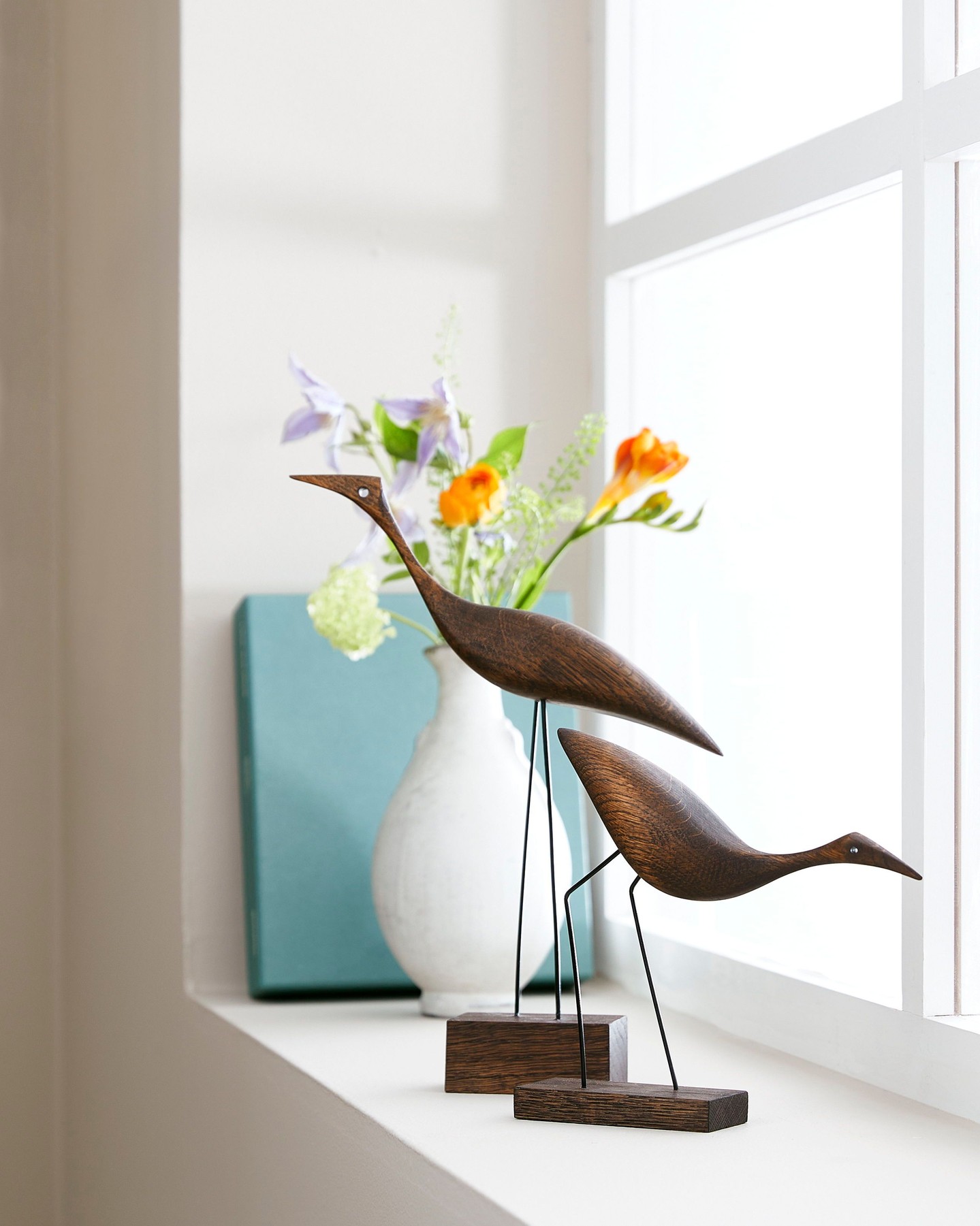 These charming teak birds, each with their own character and