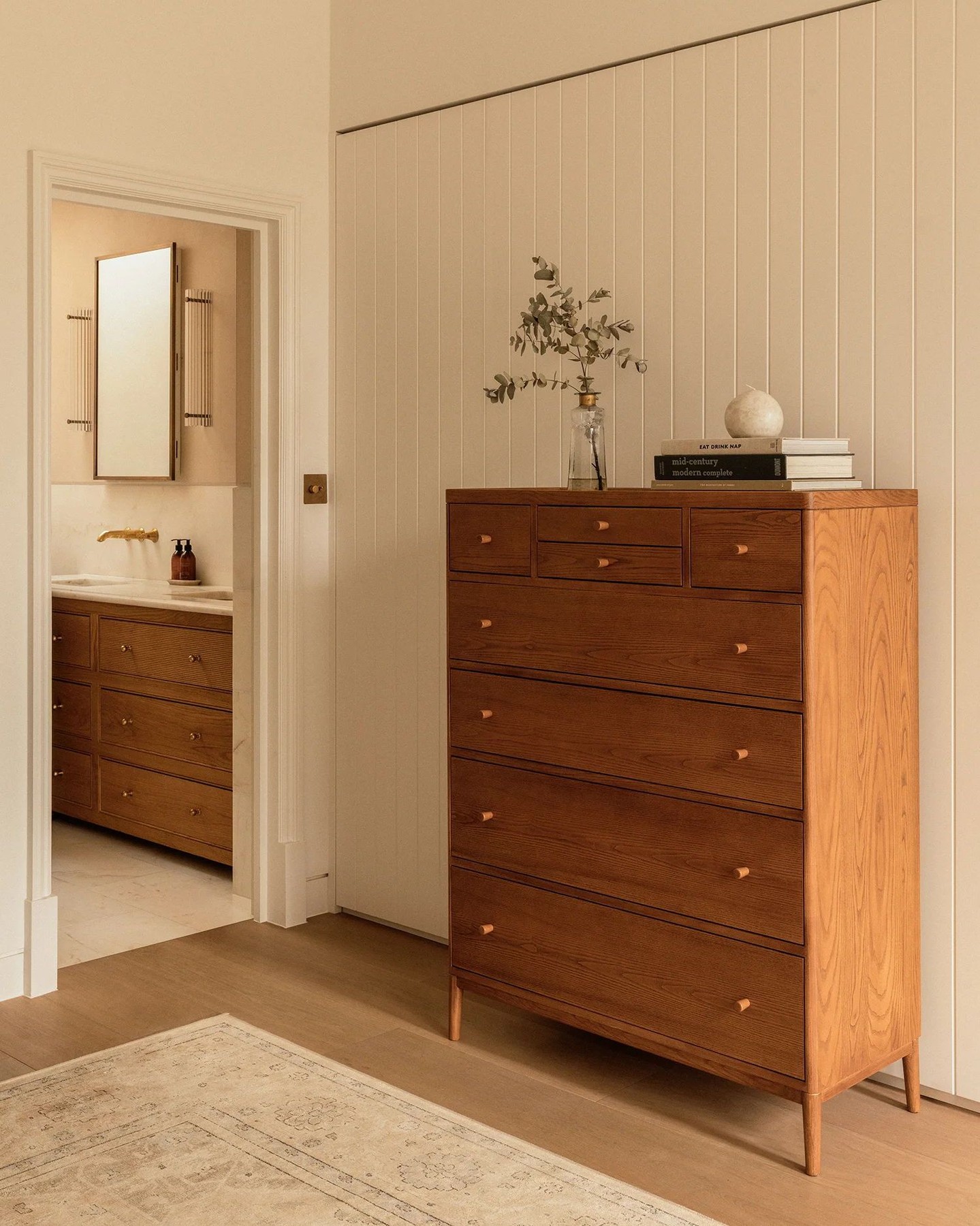 The Salina 8-Drawer Tall Chest features a contemporary, eleg