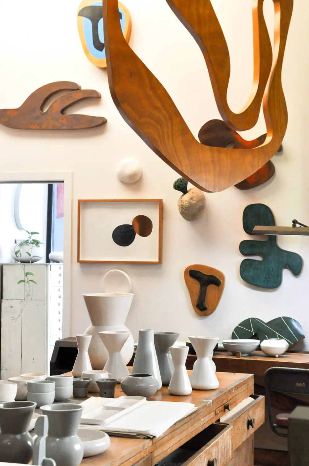 Gidon Bing working with a ceramic sculpture