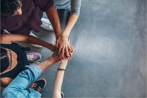 Students' collaborating with hands together