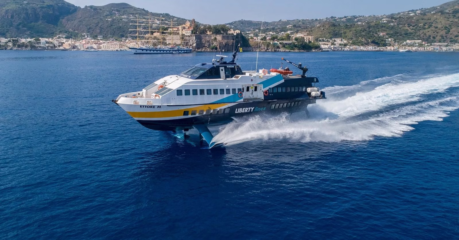 Ferry in Croatia with town in background
