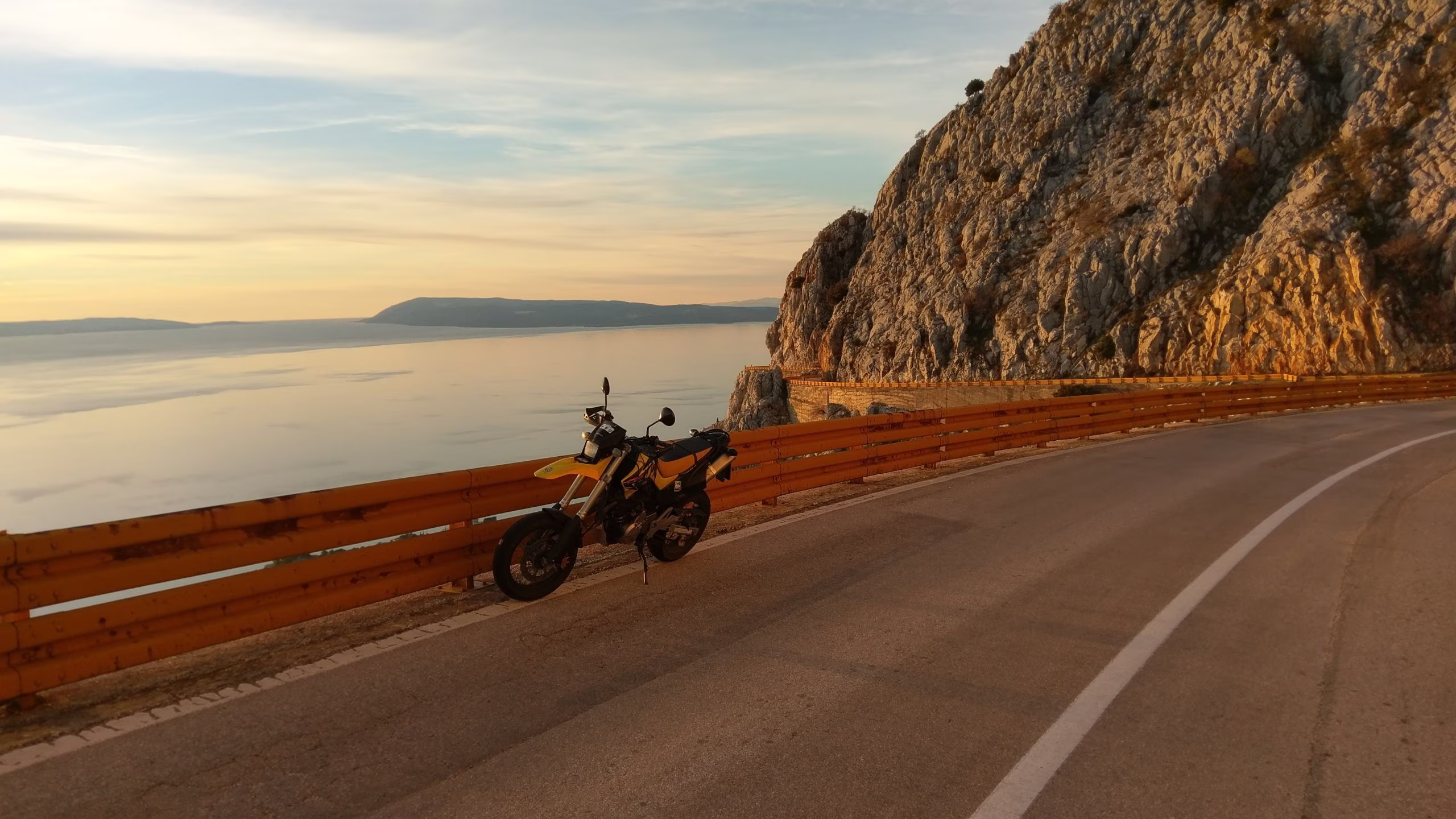Motorbike at sunset with coastal view of Croatia