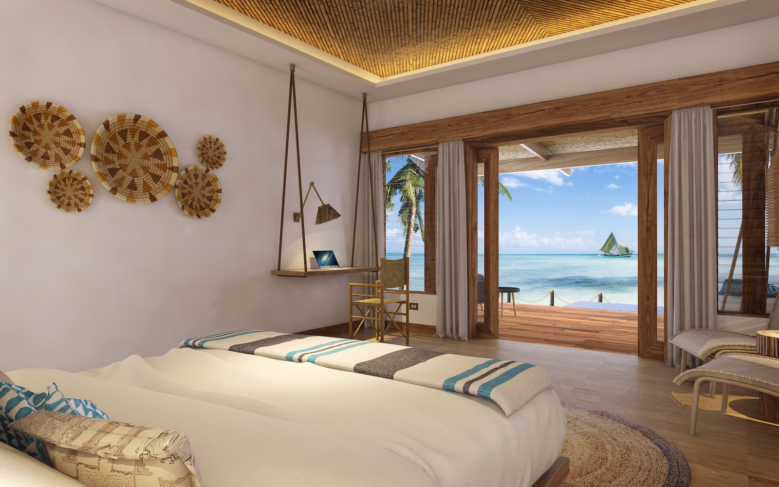 Bedroom in resort with doors open looking out onto ocean and boat