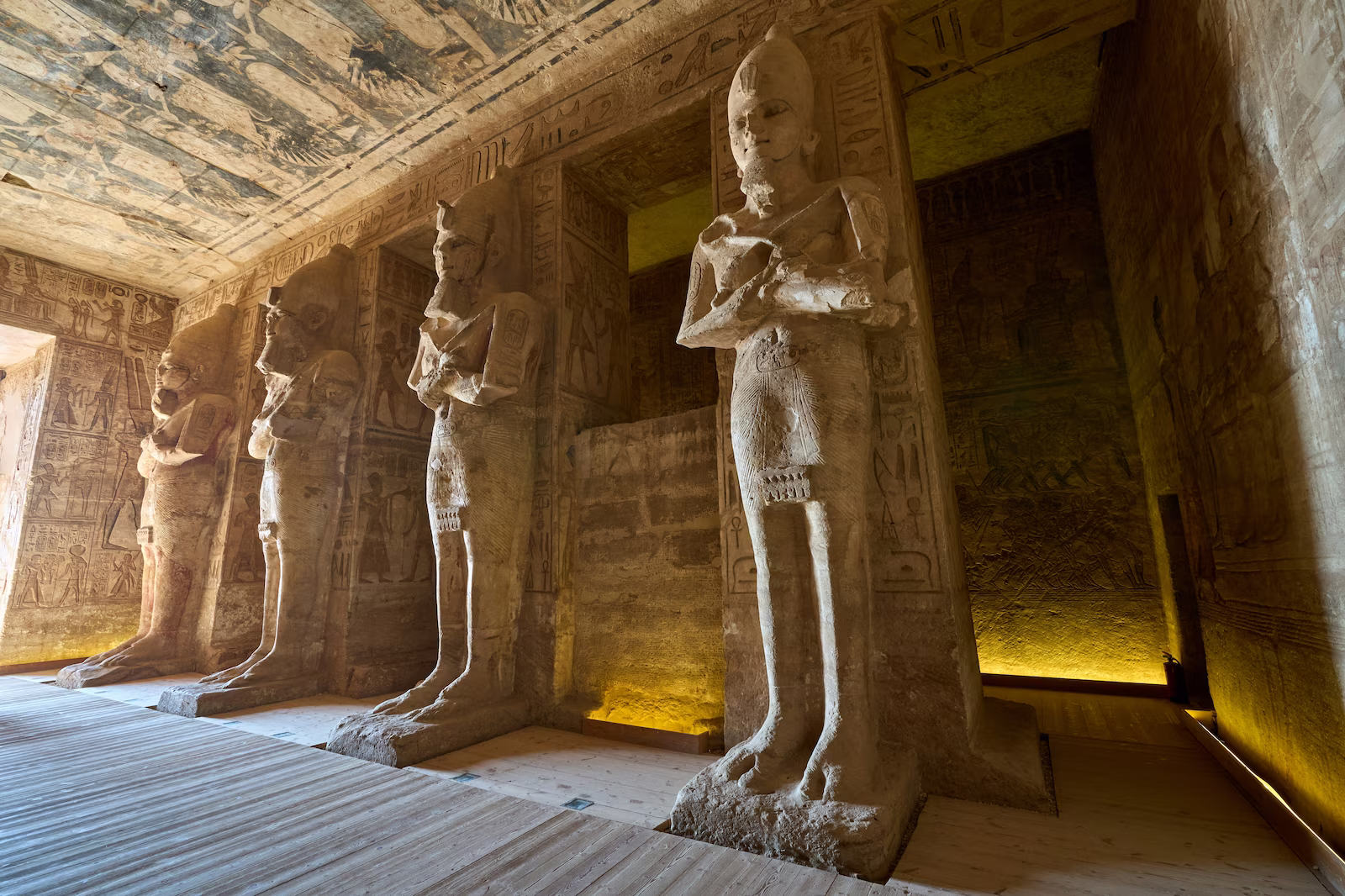 Statues and hieroglyphic in a tomb in Giza