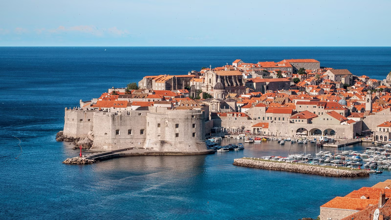 old city view of coastal city buildings with red tile roof