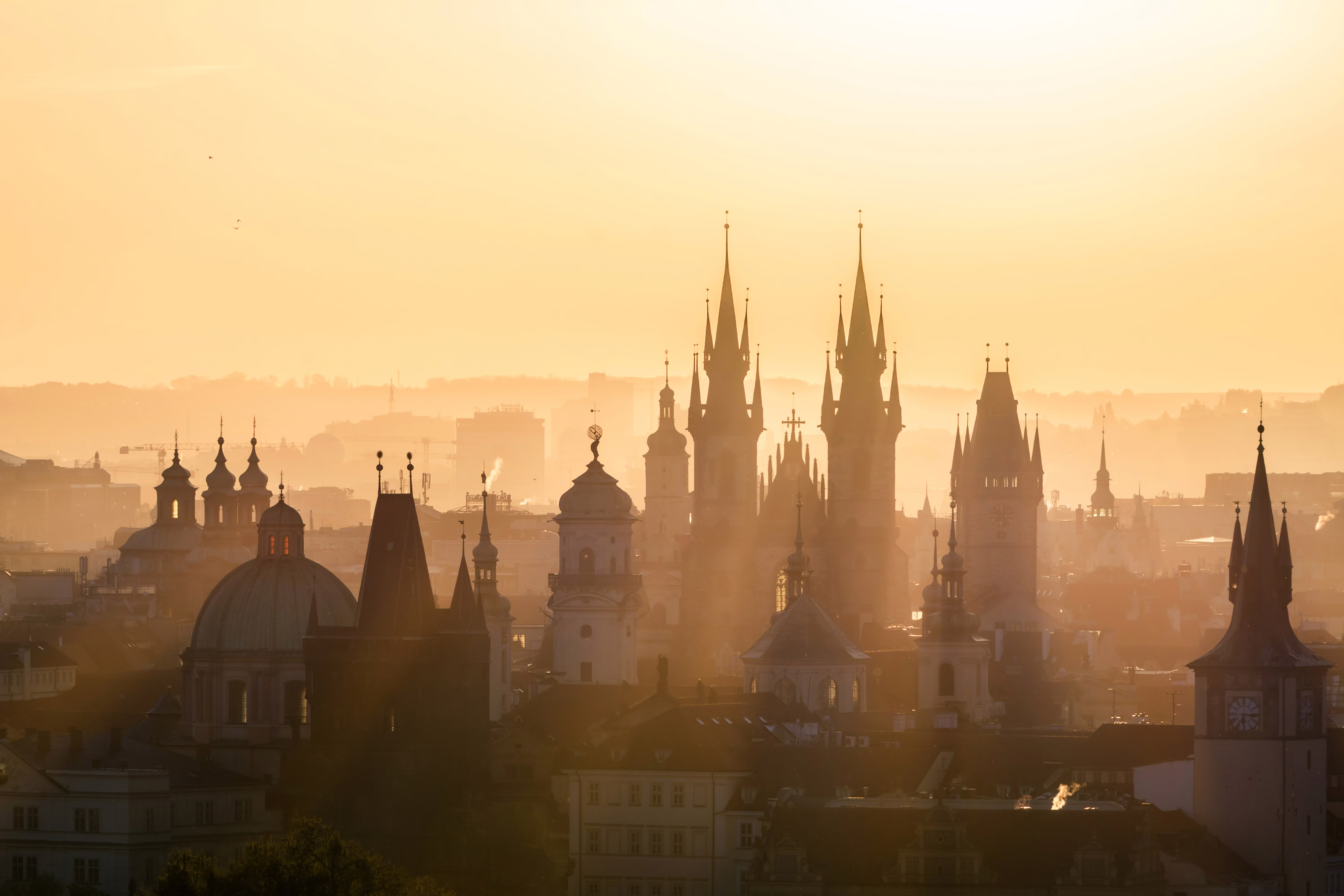 Skyline view of spires in Prague at sunrise