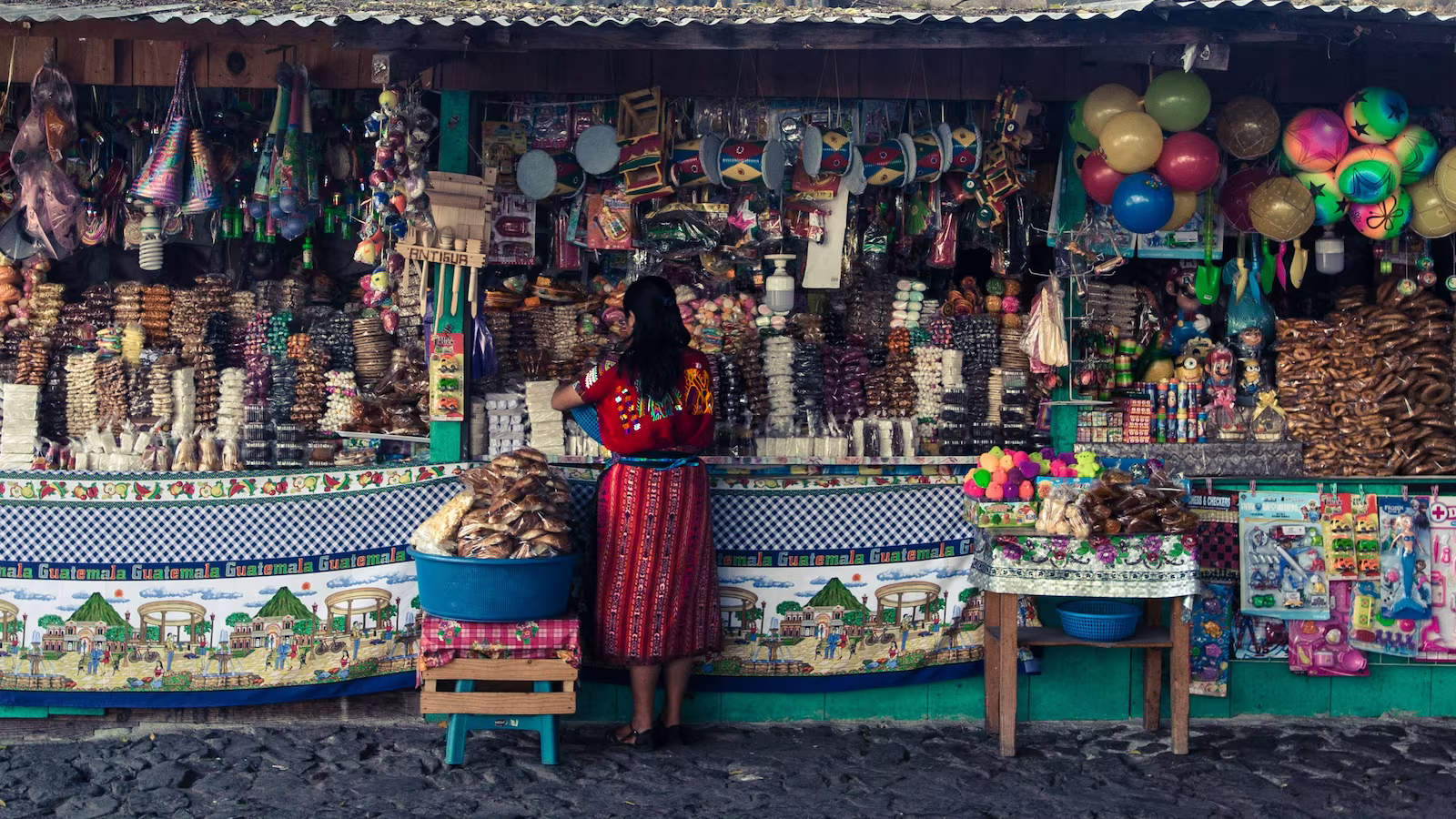 street market with lots of colourful objects in a stall