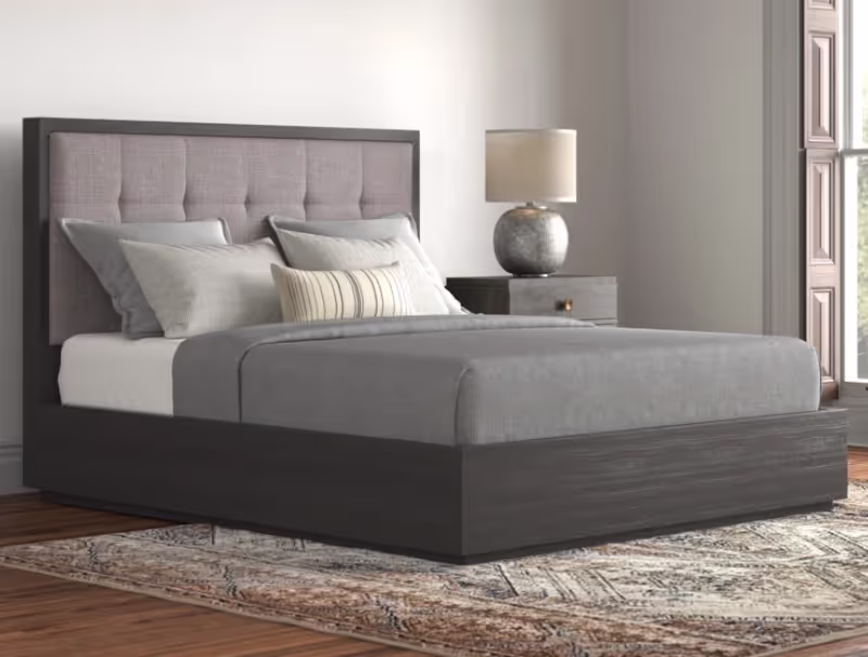 Grey platform bed with storage, a headboard with light gray cushion and a mattress with grey bedwear