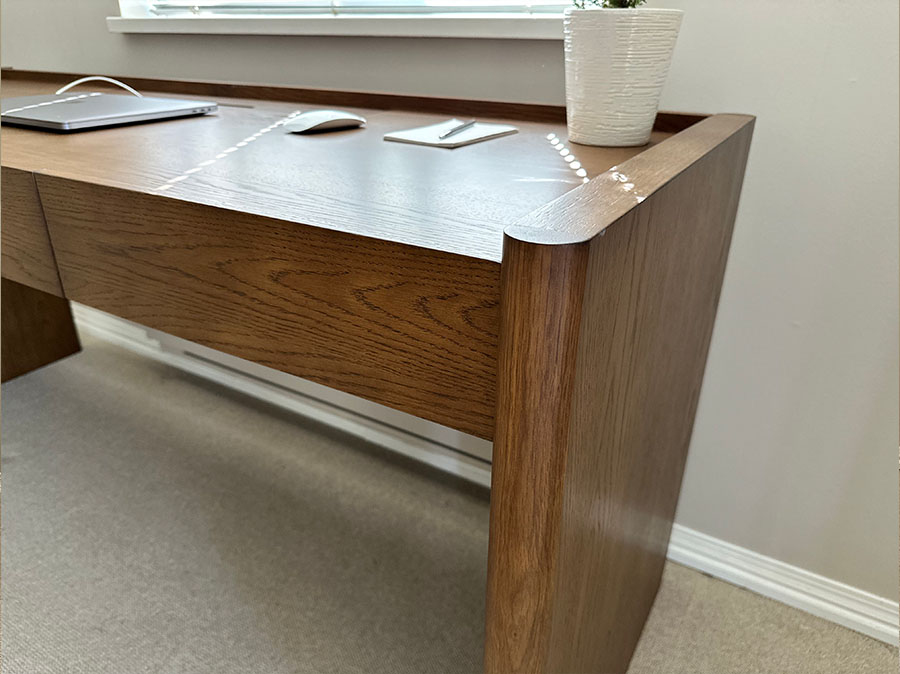 The Torme Smoked Oak Desk at working place