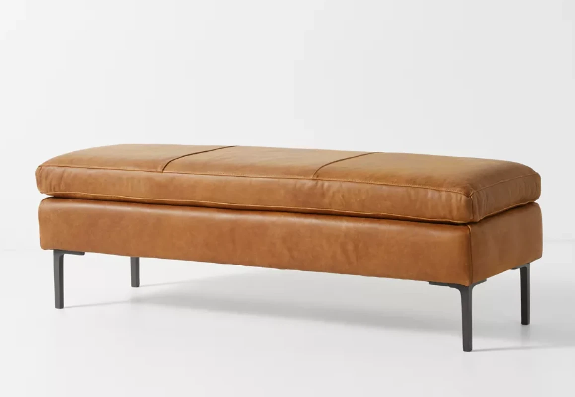 Brown leather bench with wooden legs