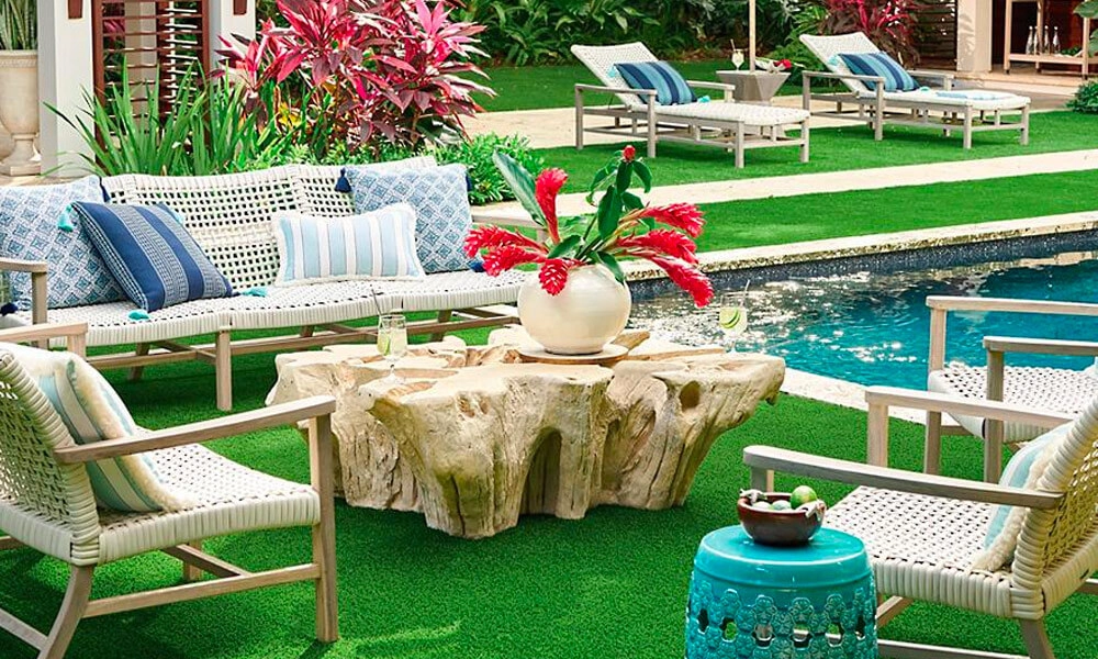 A serene backyard oasis featuring a sparkling pool and comfortable outdoor furniture.