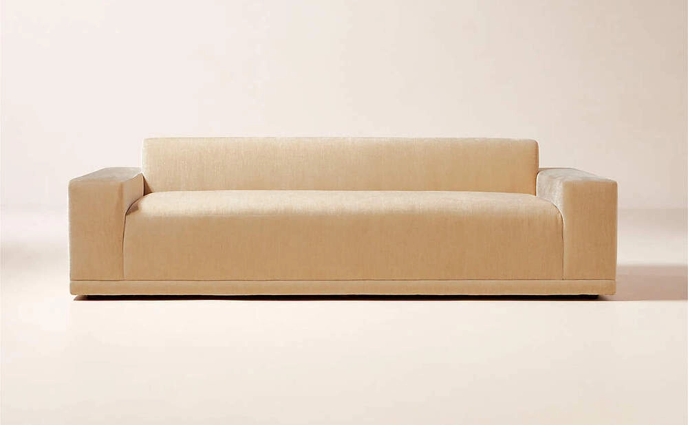 Beige upholtered sofa with a low profile design