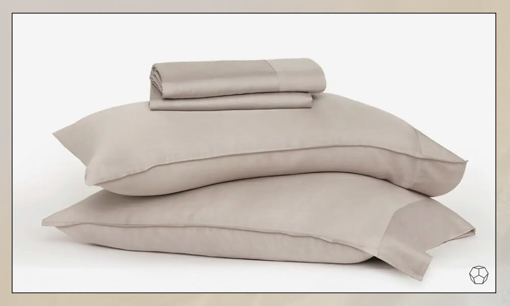 Beige Bedding sheets and two pillows with pillowcases