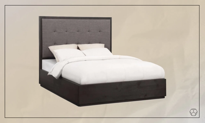 Dark gray upholstered bed with a gray headboard, a mattress with white sheets and four pillows