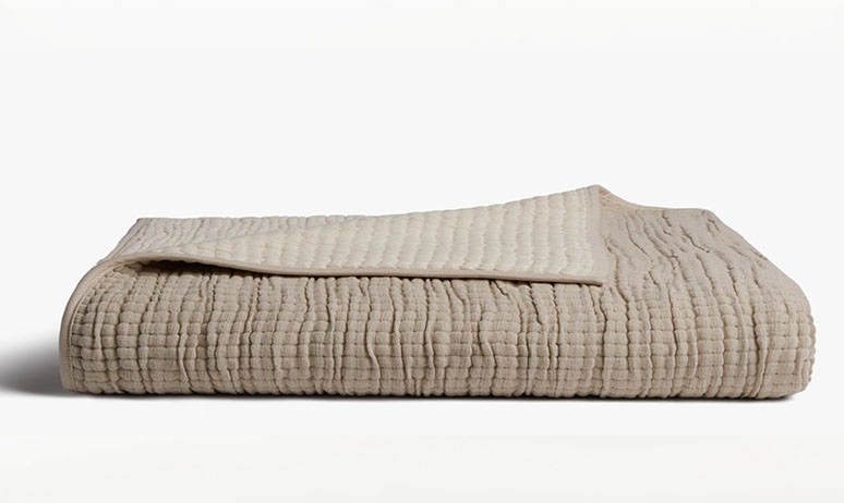 Brown folded throw blanket