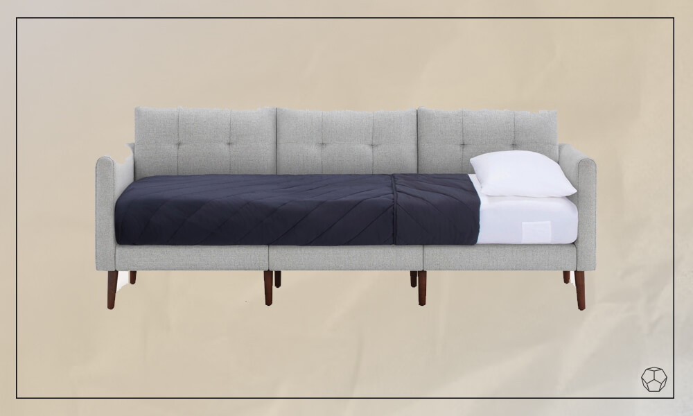 Gray upholstered sleeper with a seat cushion that transforms into a bed.