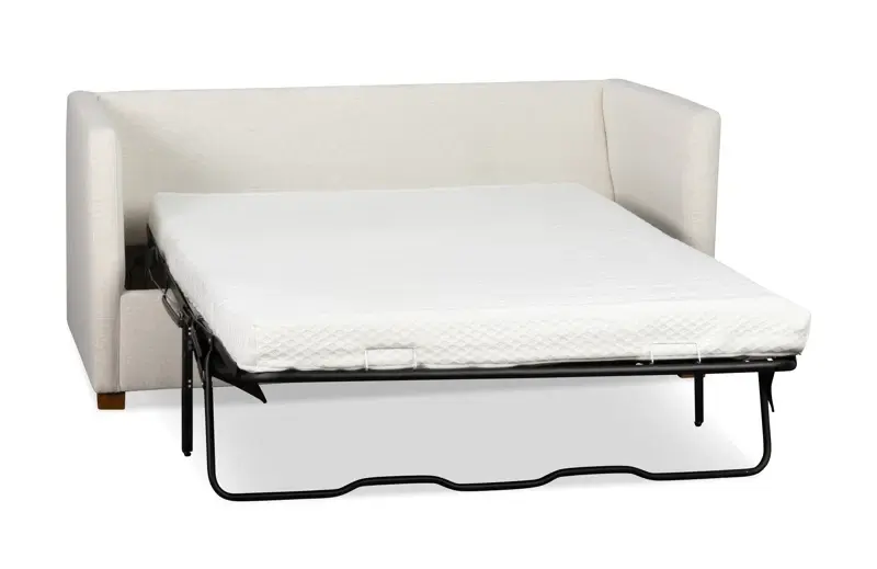 white sleeper sofa with a mattress