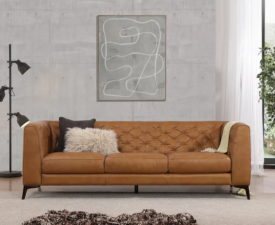 Leather Brown sofa near gray Wall