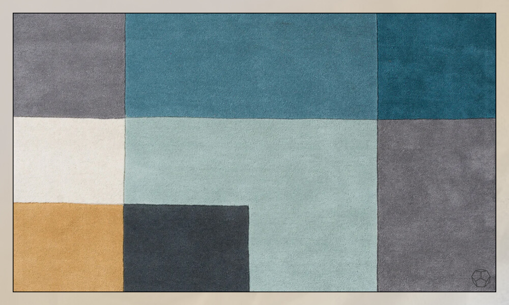 Rug with geometric swuares each with a different color in a gray, blue and yellow color pallette