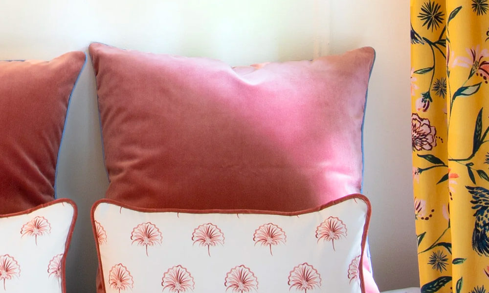 Two pink velvet pillows
