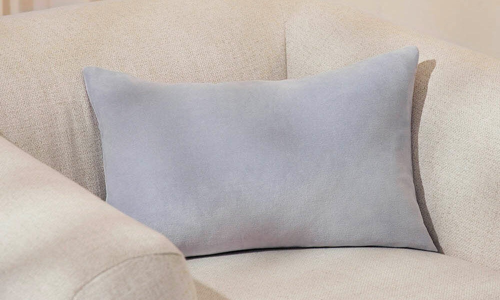 grey Velvet Pillow in a couch