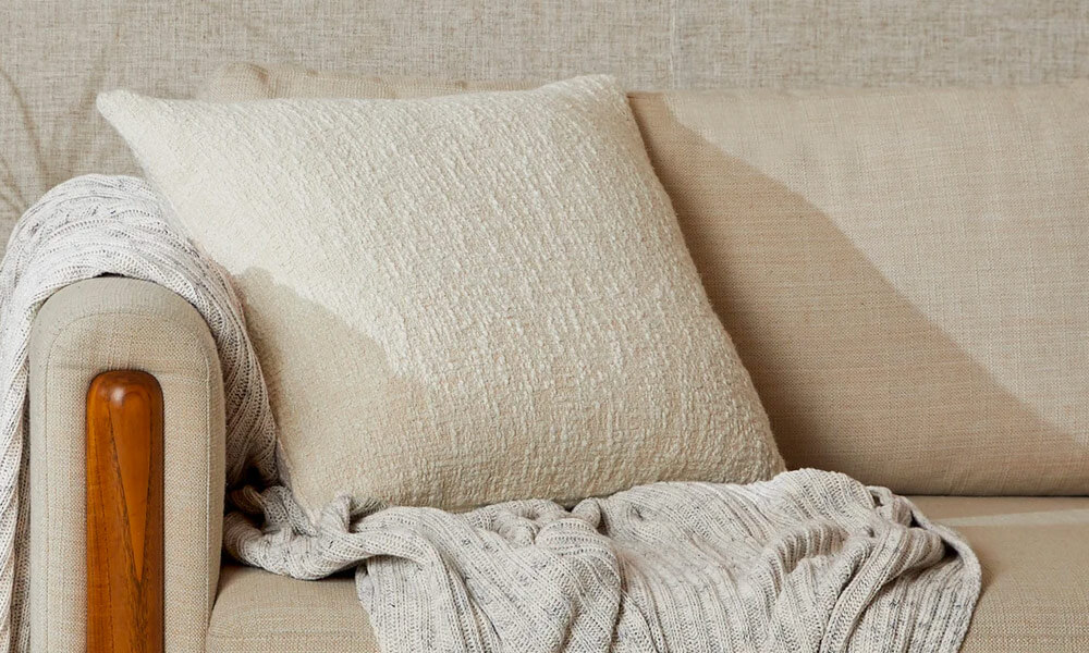 Undyed cotton pillow in a beige couch