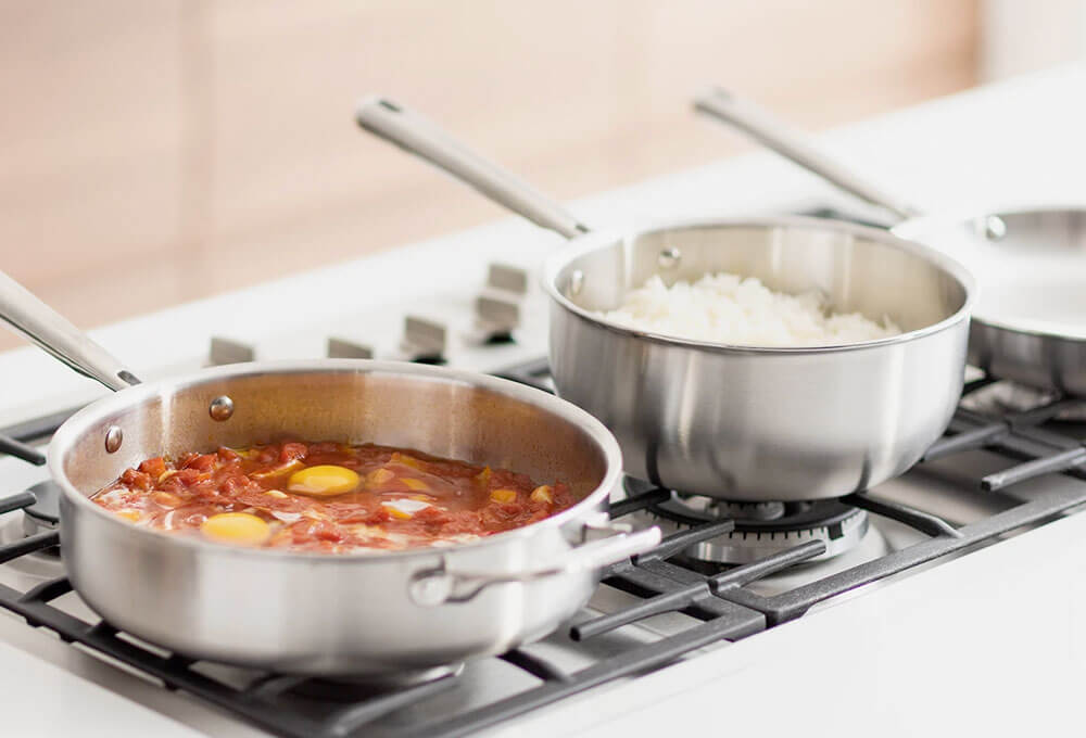Two Misen Stainless Steel pans in a kitchen