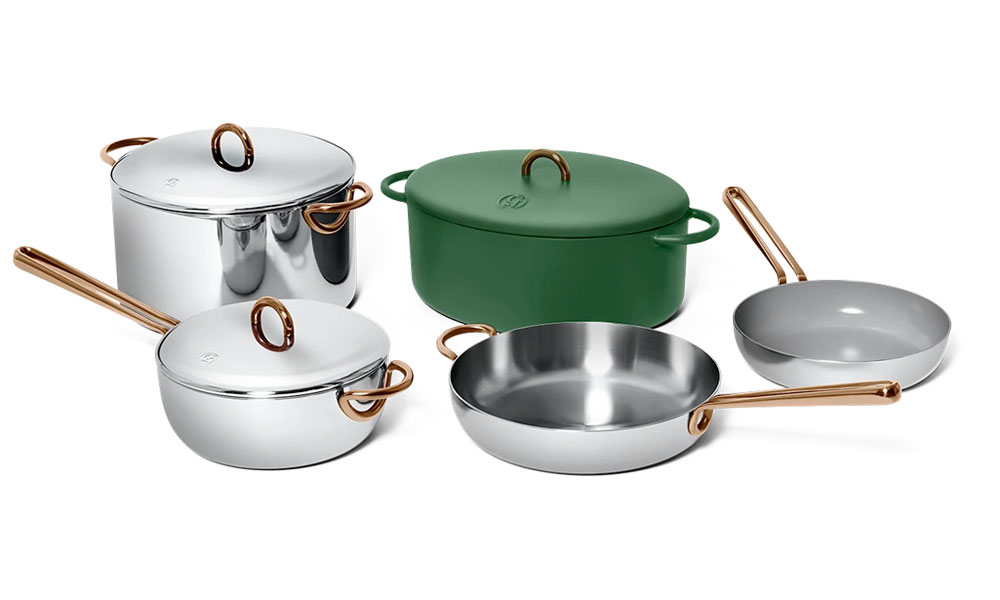 A collection of green and silver pots and pans with sturdy handles