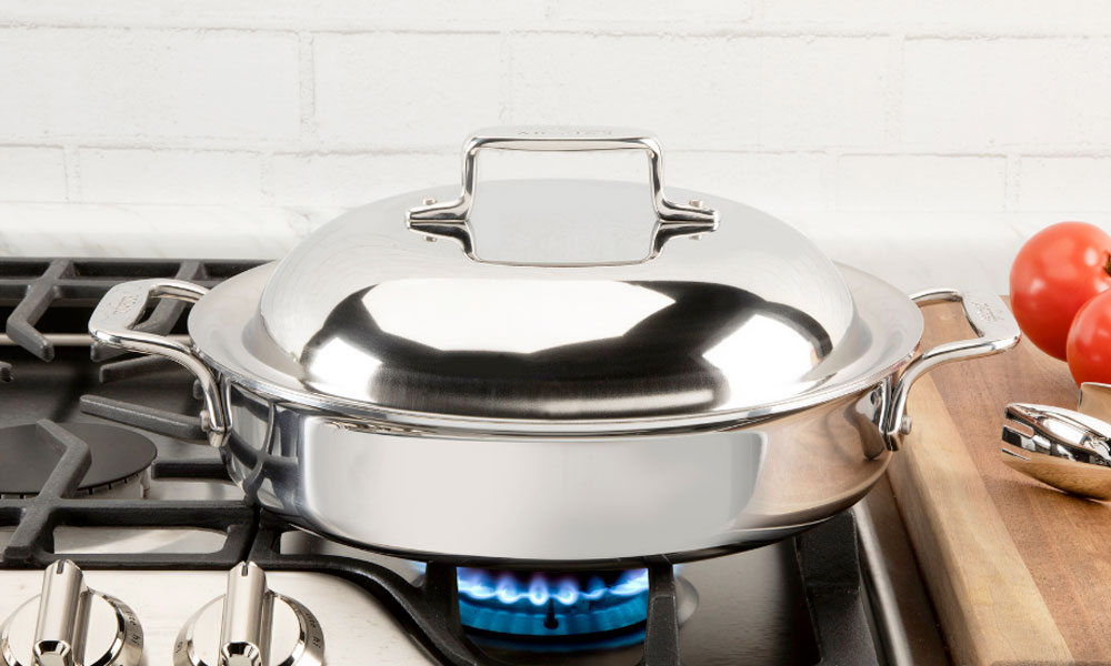 Stainless steel pot positioned on a gas stove showcasing its shine and functionality in a kitchen