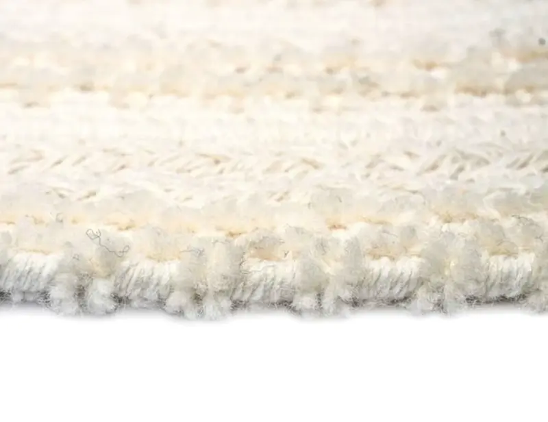 Detail of a braided and textured wool rug