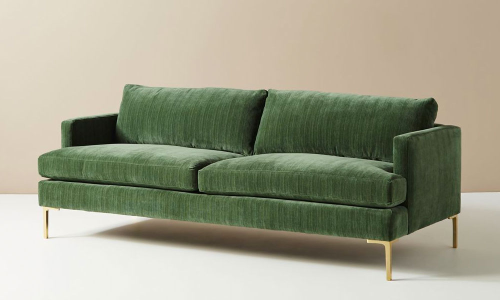 Green Sofa with thin golden legs