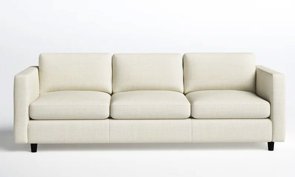white upholstered sofa with black legs