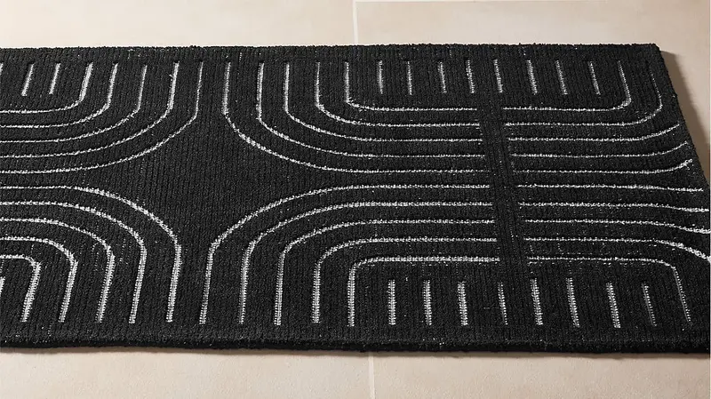 black rug with white patterns